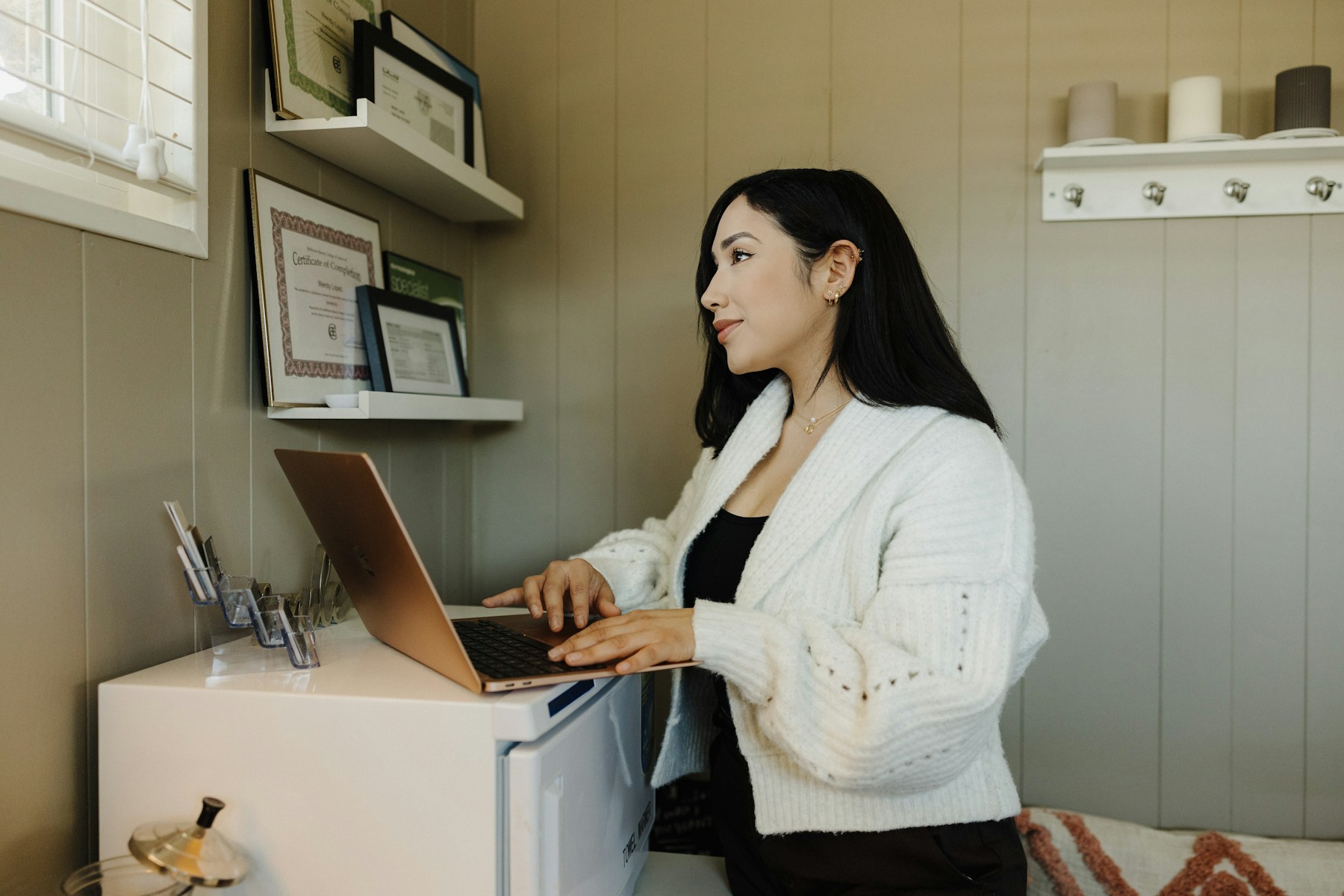A small-business owner working from her creative studio